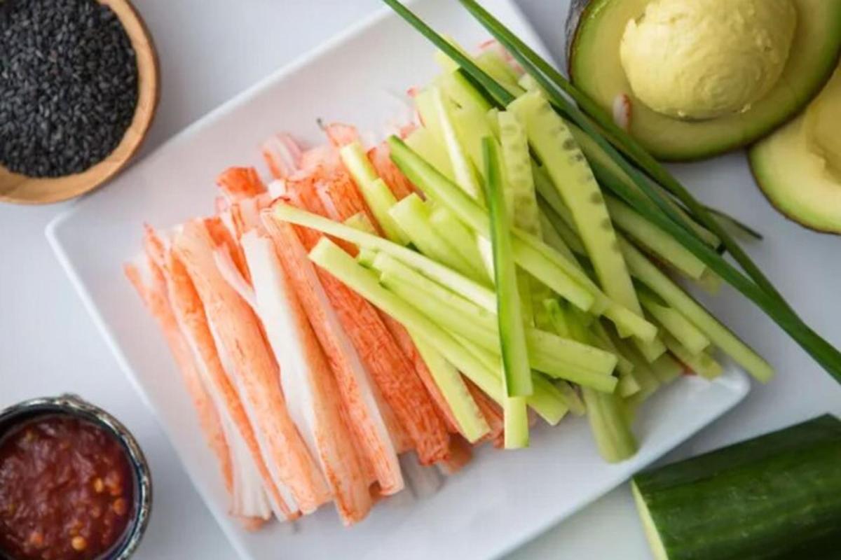 a plate of fish and vegetables on a table
