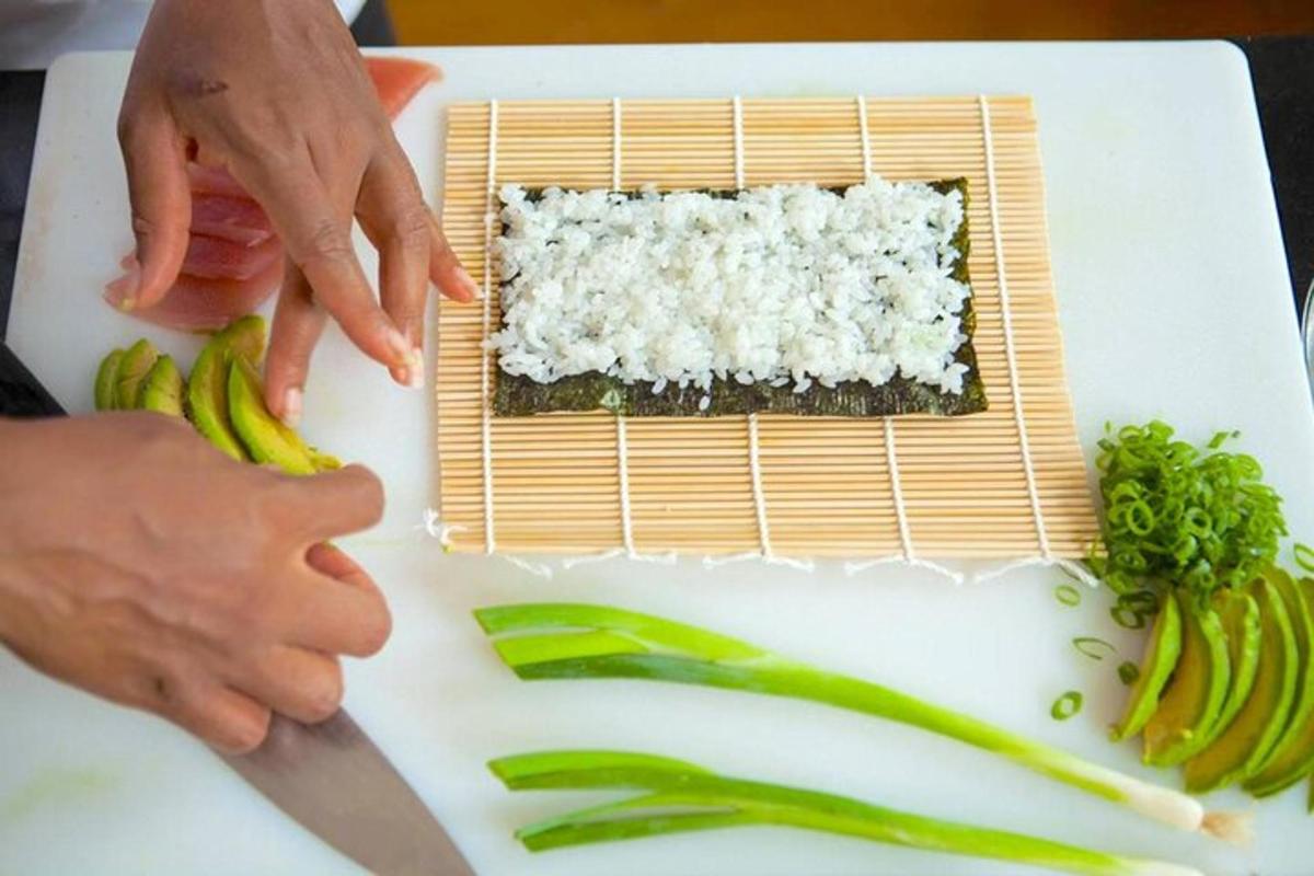 a person cutting up vegetables on a cutting board