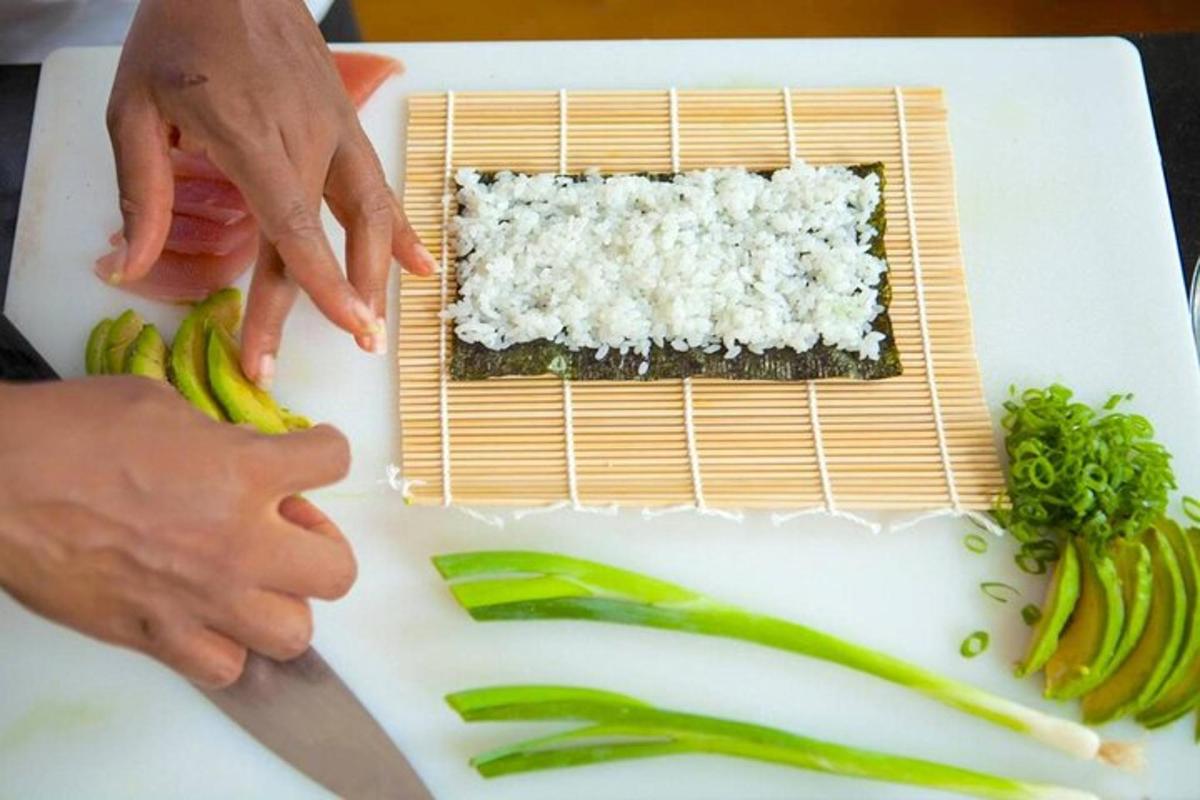 a person cutting up vegetables on a cutting board
