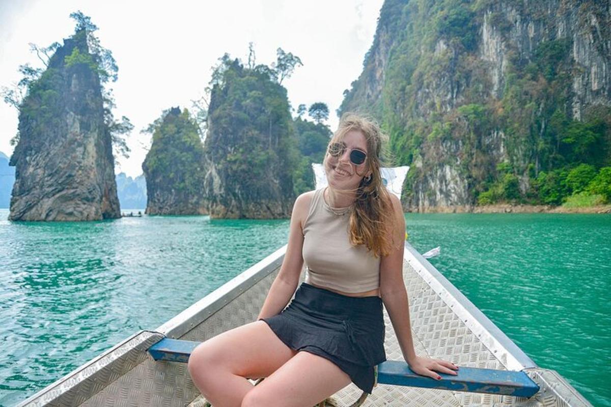 a woman sitting on a boat in the water