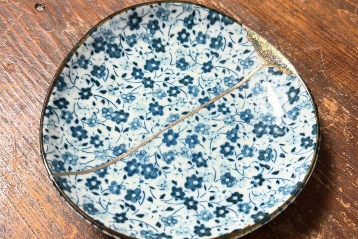 a blue and white plate on a wooden table
