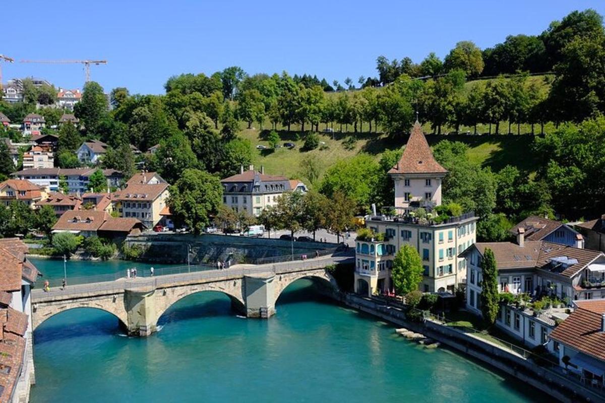 a bridge over a river in a town with buildings