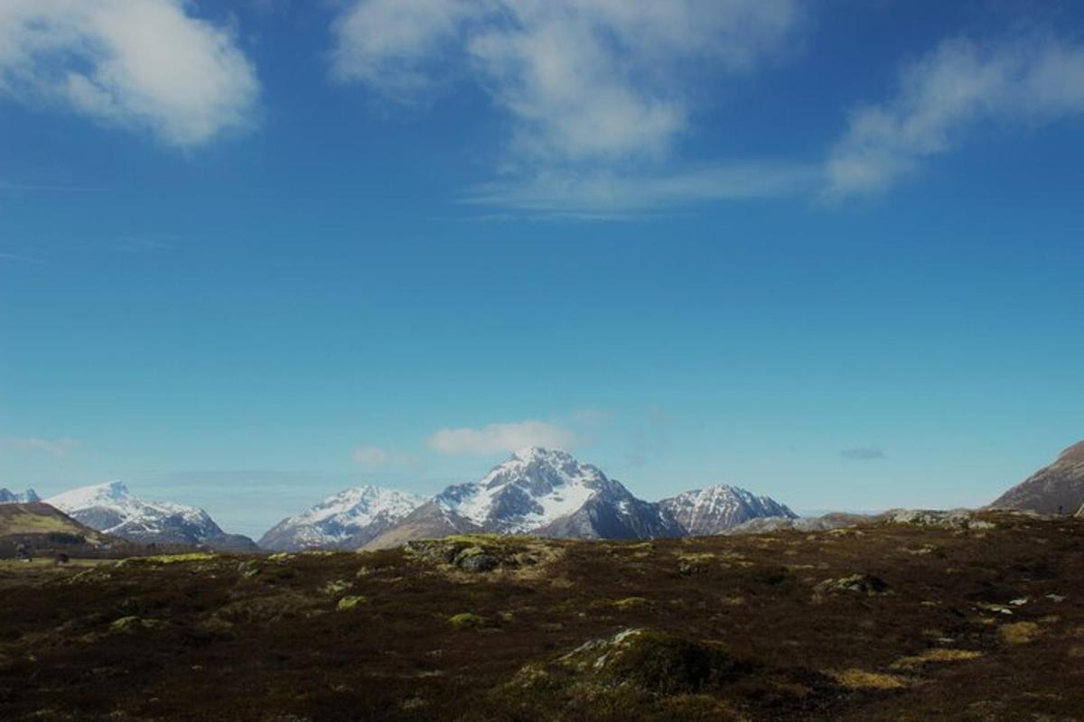 a view of a mountain range with snow covered mountains