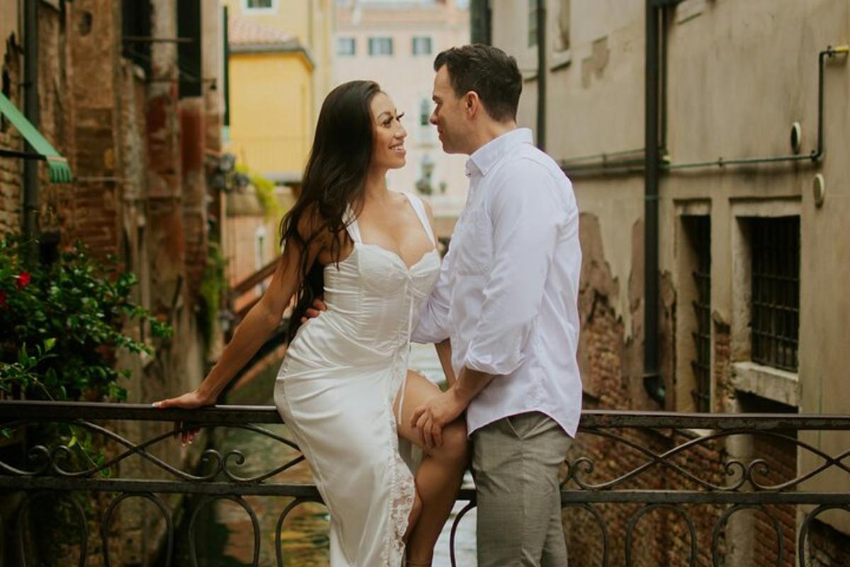 a man and a woman standing next to a fence