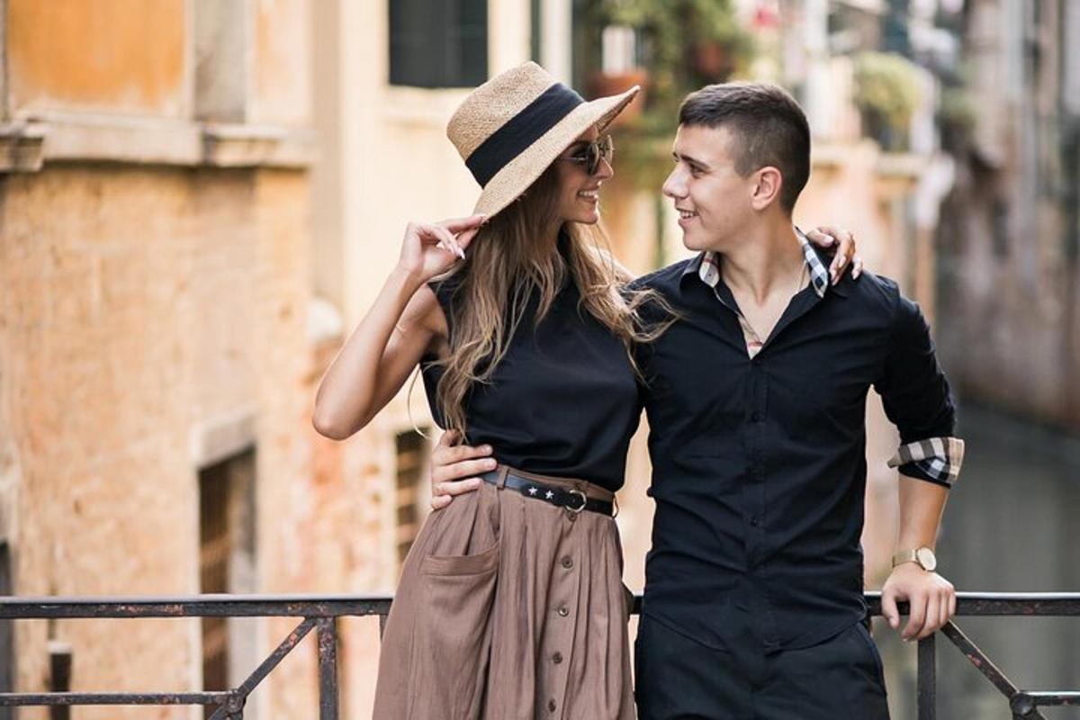 a man and a woman standing next to a fence