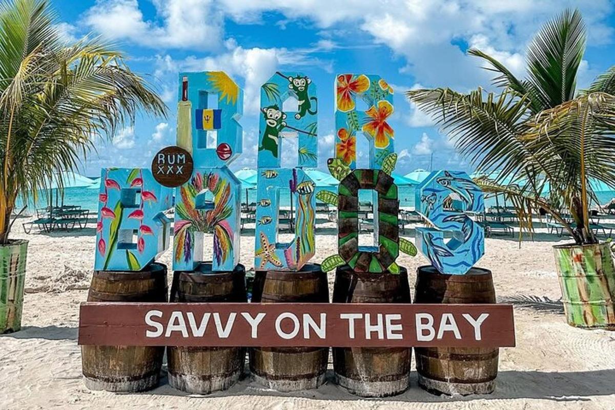a sign on the beach with a sign sayingwalk on the bay