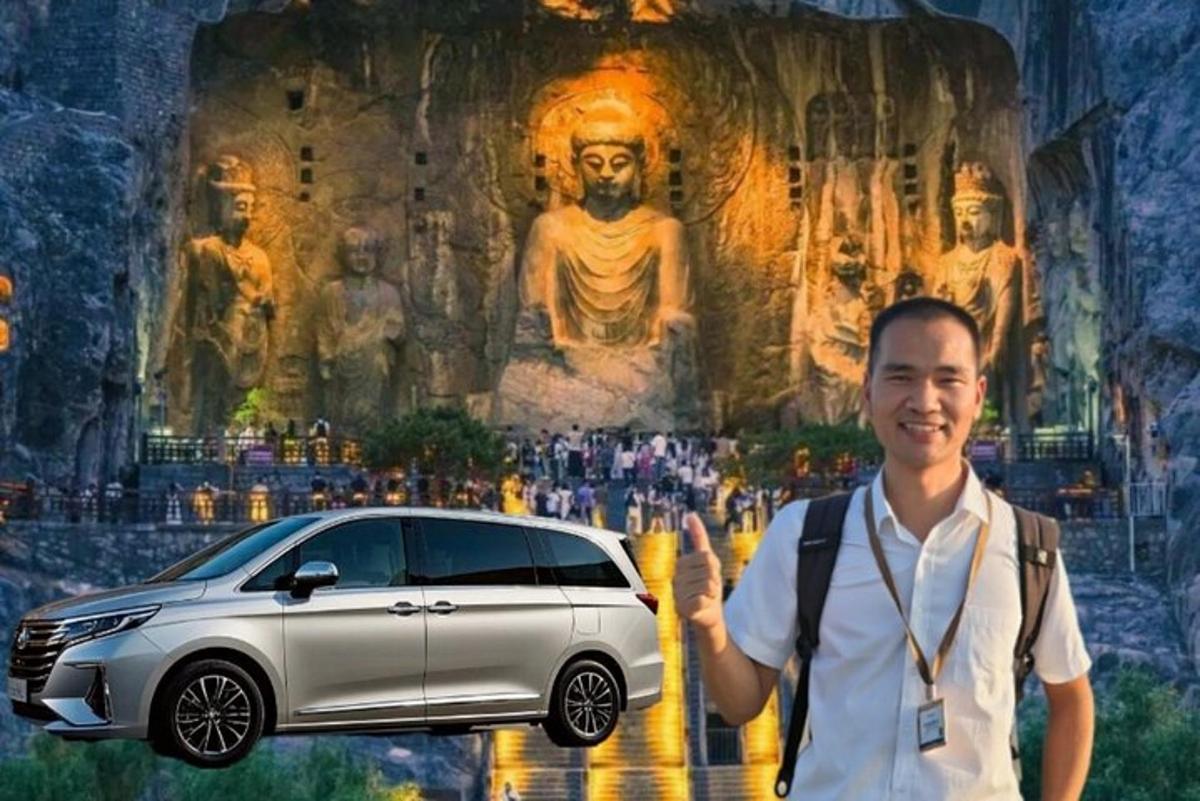 a man standing next to a white car in front of a painting