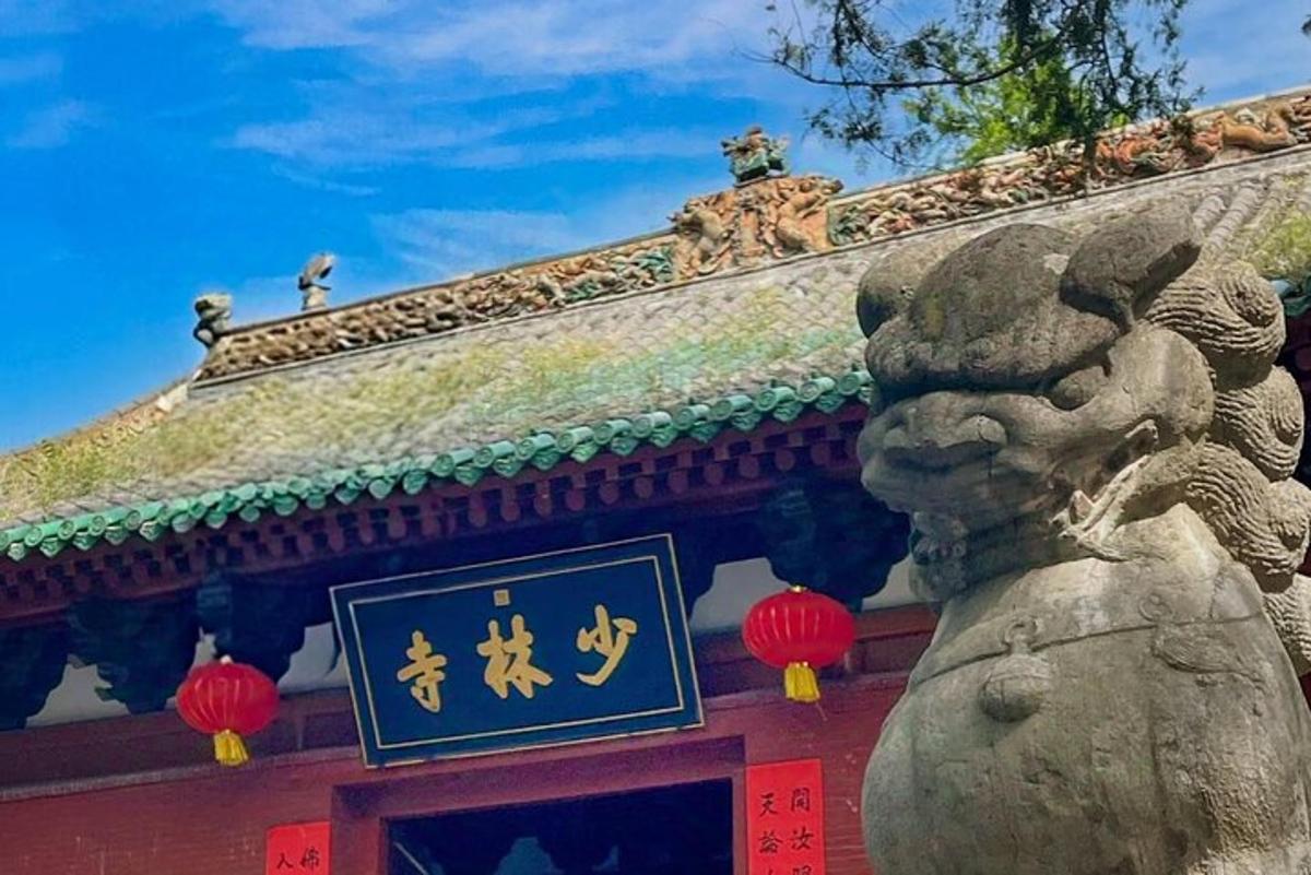 a building with a sign on it with a statue