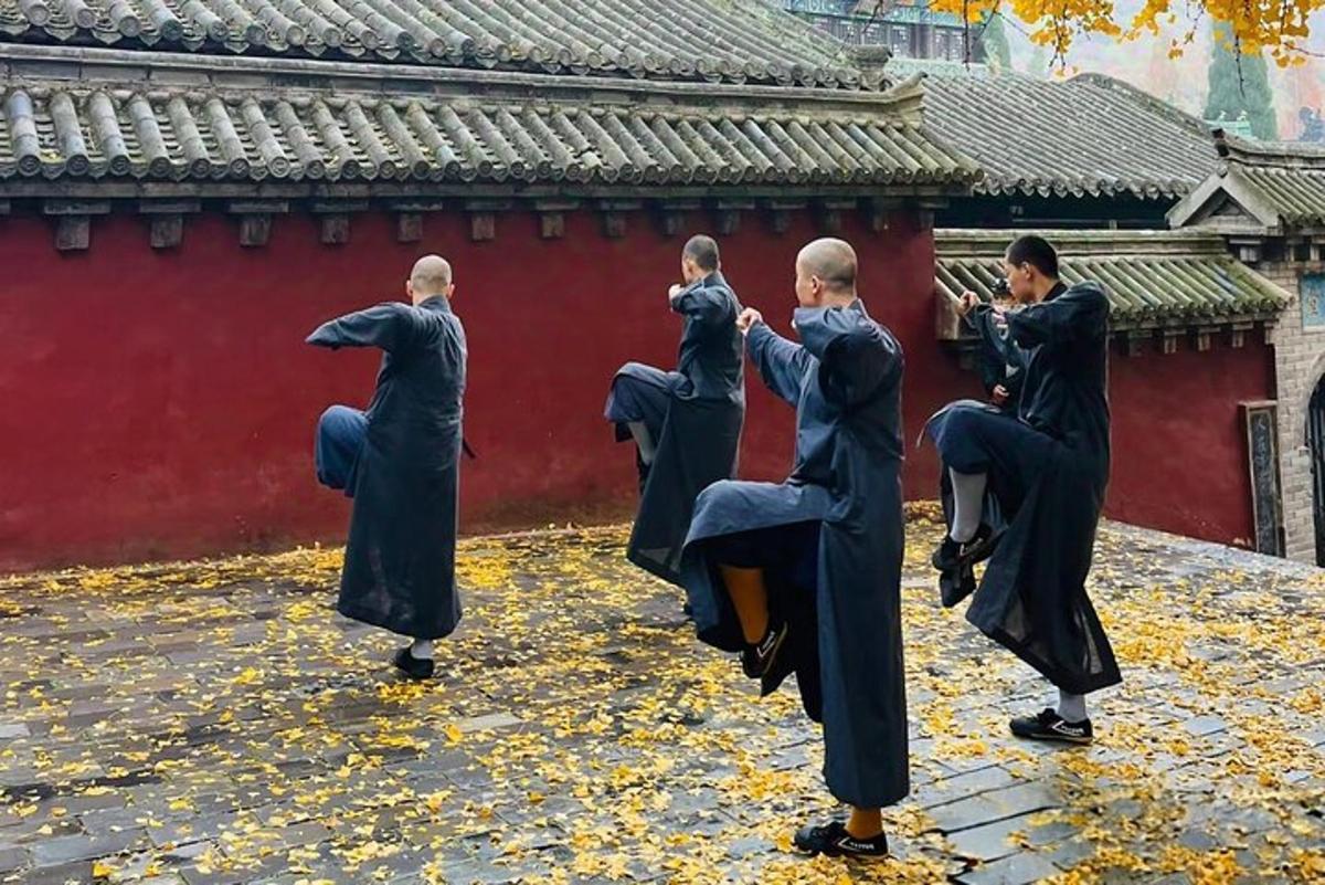 a group of men in kimonos dancing in front of a building