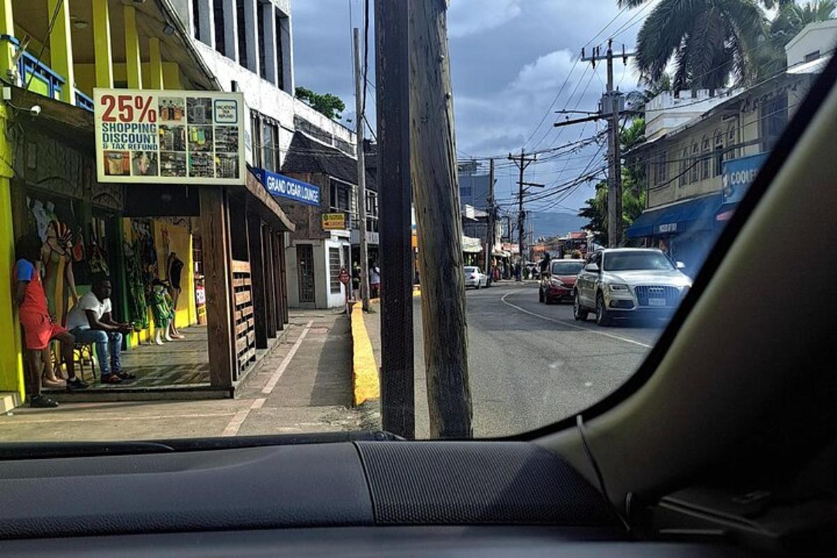 a view of a street from the inside of a car