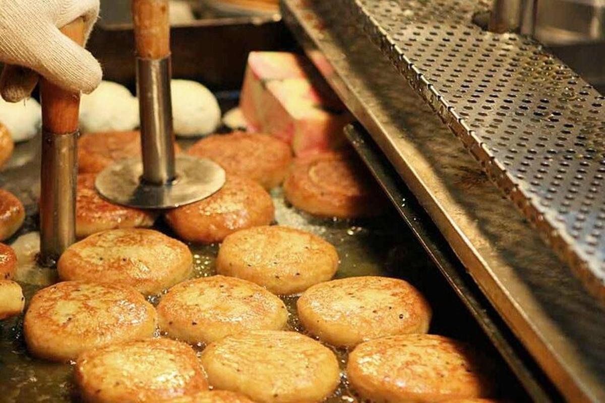 a bunch of donuts are being made in a machine