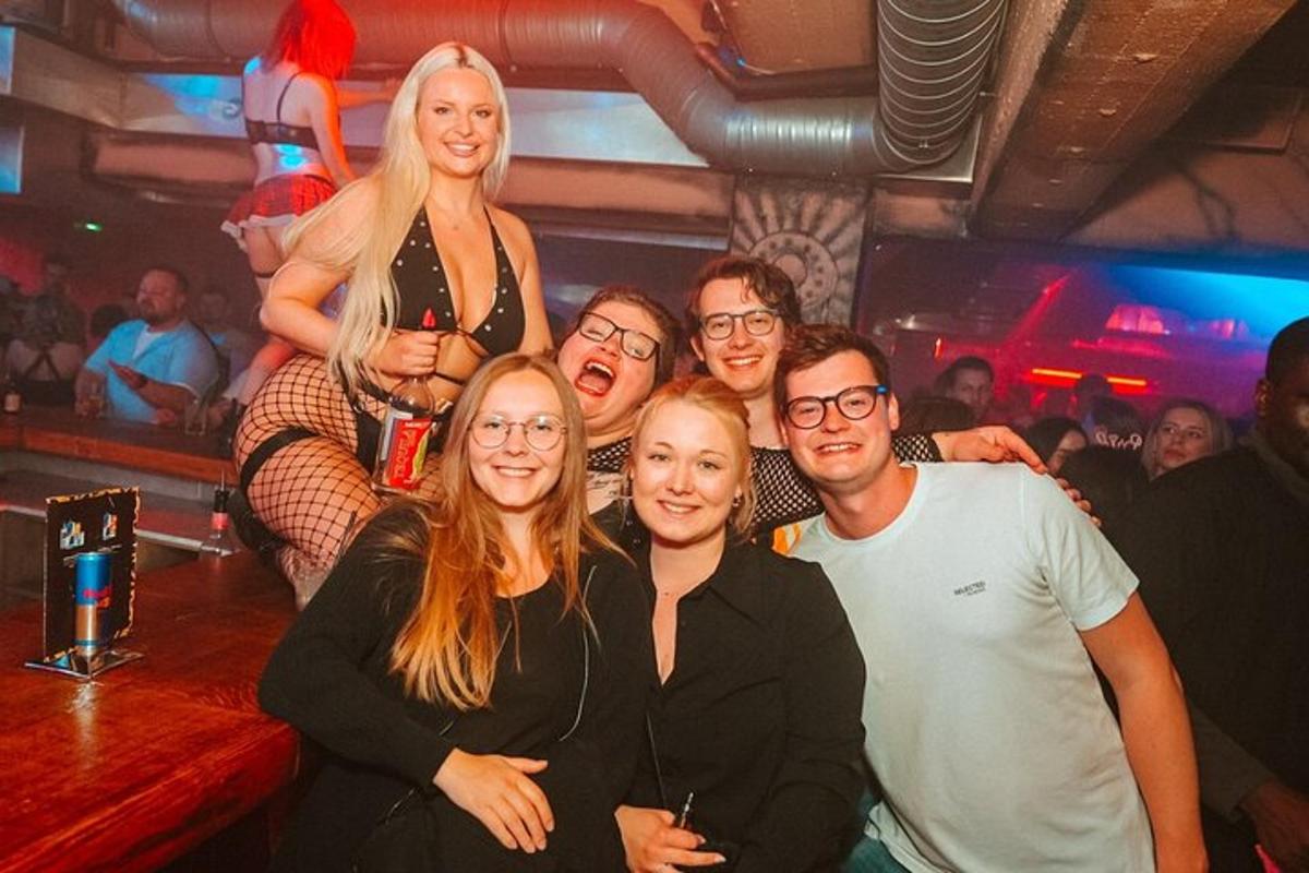 a group of people posing for a picture in a bar