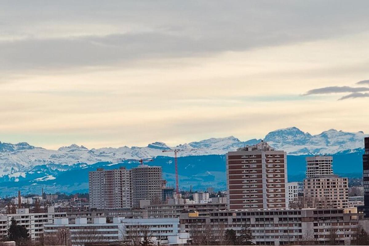a view of a city with mountains in the background
