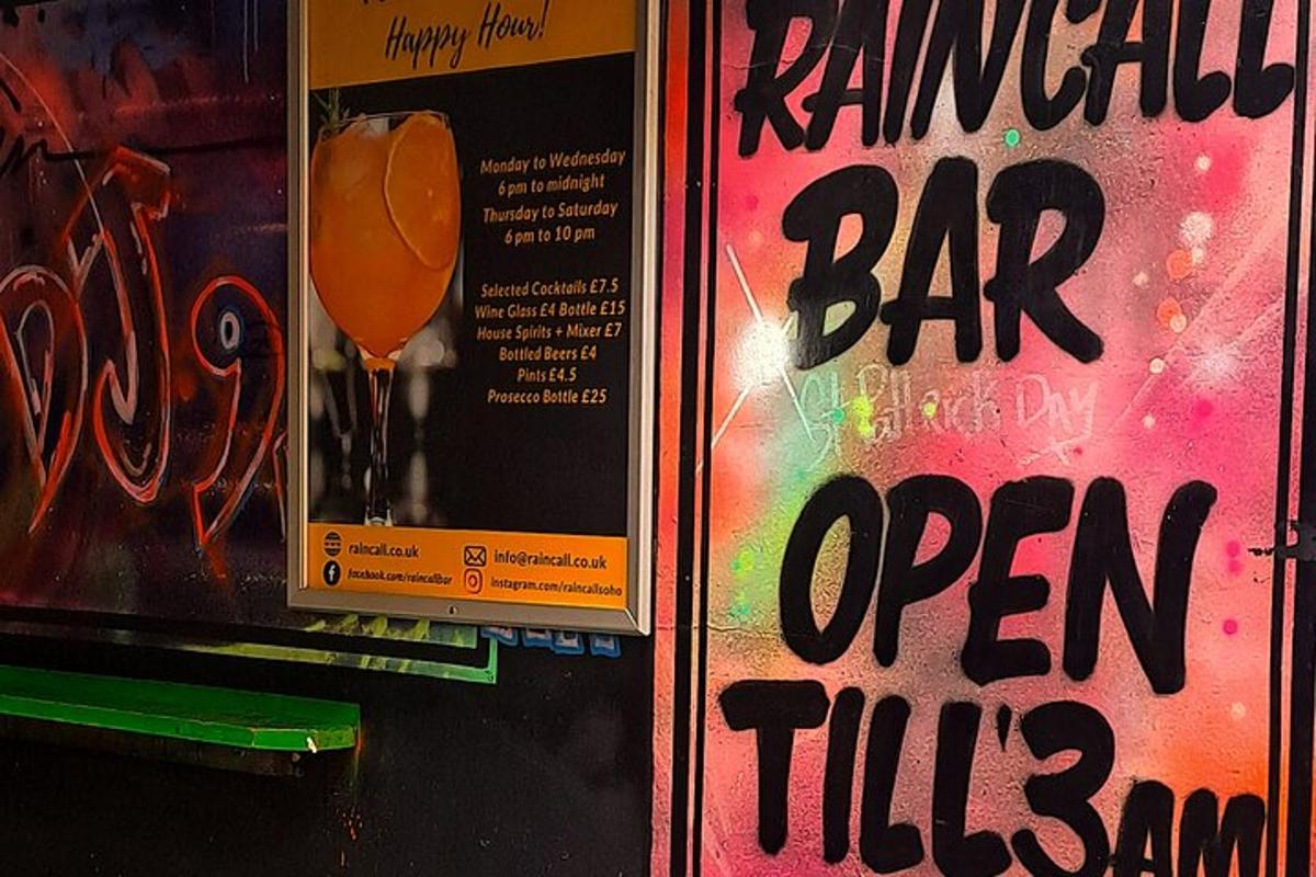 a sign for a bar with a bar open till