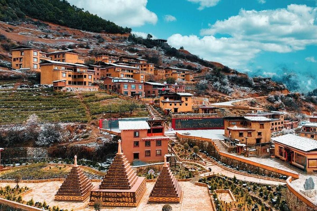 a village on a hill with houses and buildings