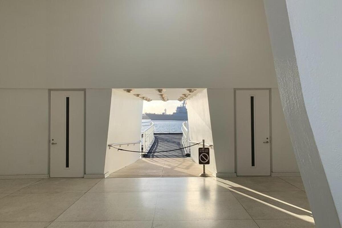 a hallway of a building with a view of the water