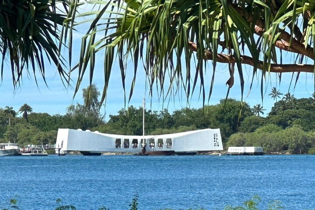 a large white building in the middle of a body of water