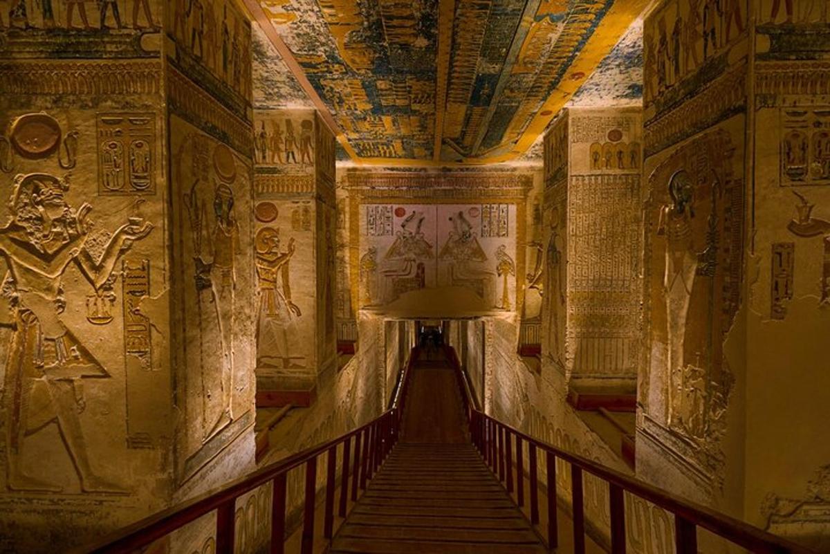 a hallway in an ancient building with paintings on the walls