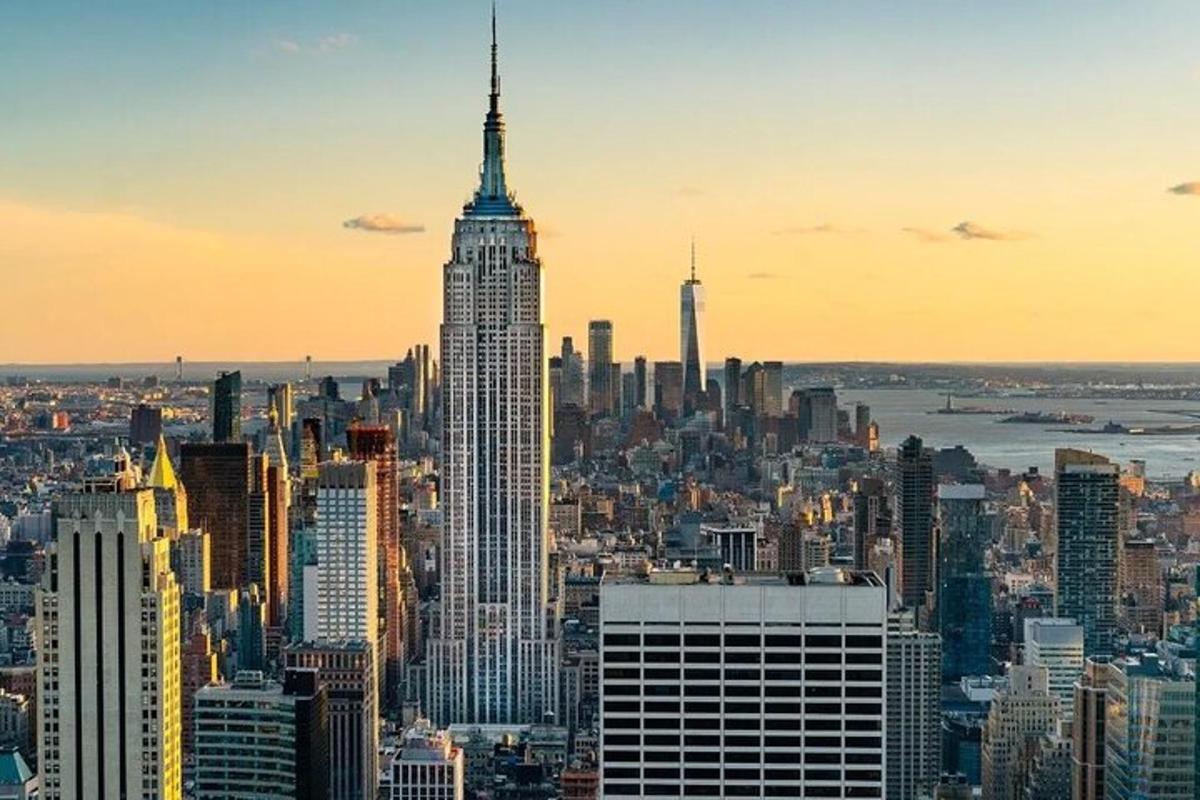 a view of the empire state building at sunset