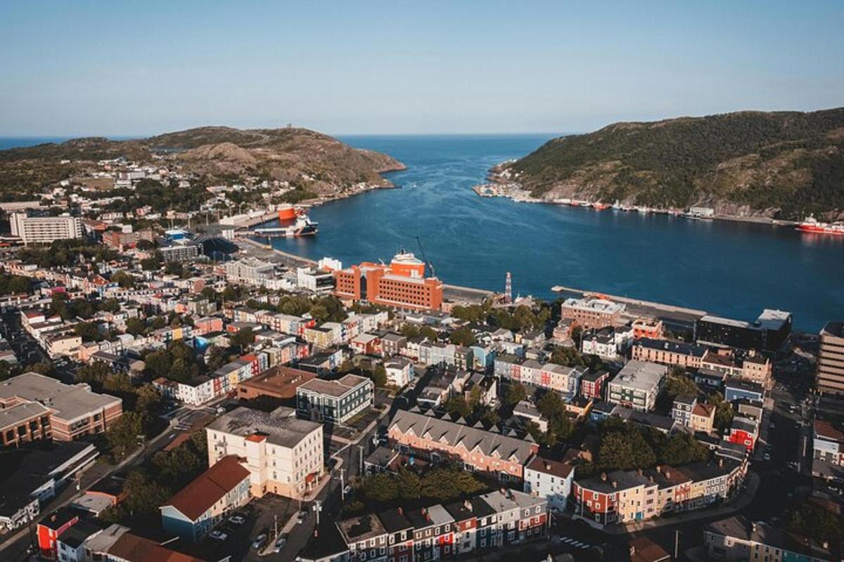 an aerial view of a city next to the water