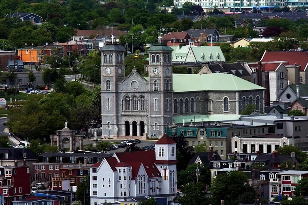a large building with a clock tower in a city