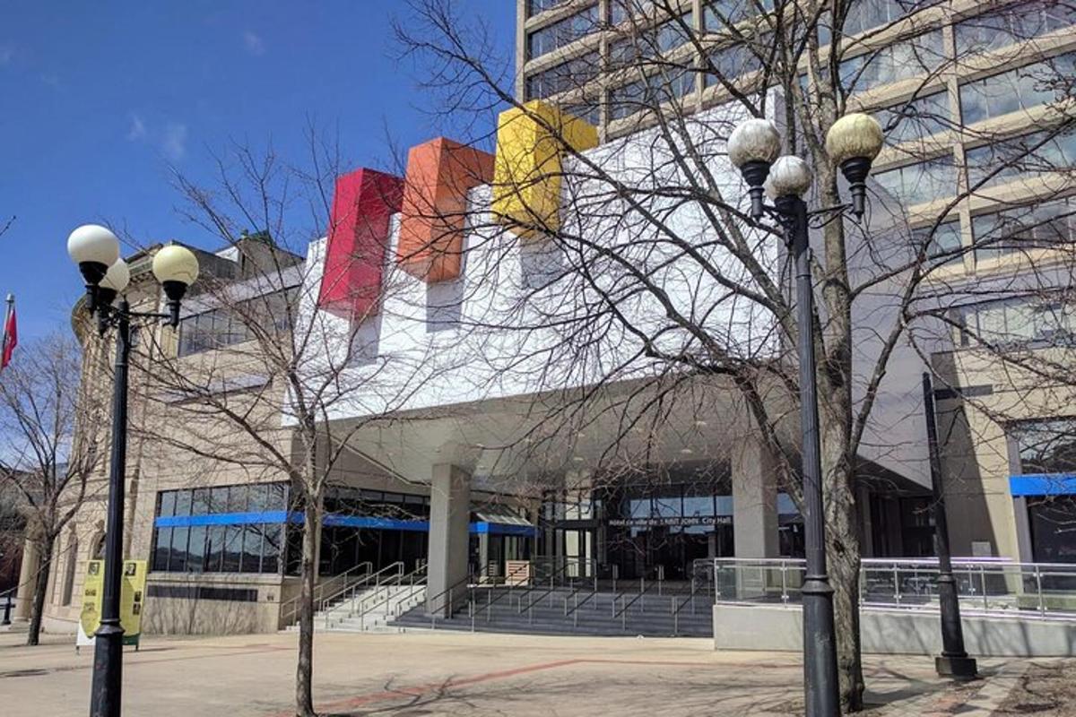 a building with two street lights in front of it