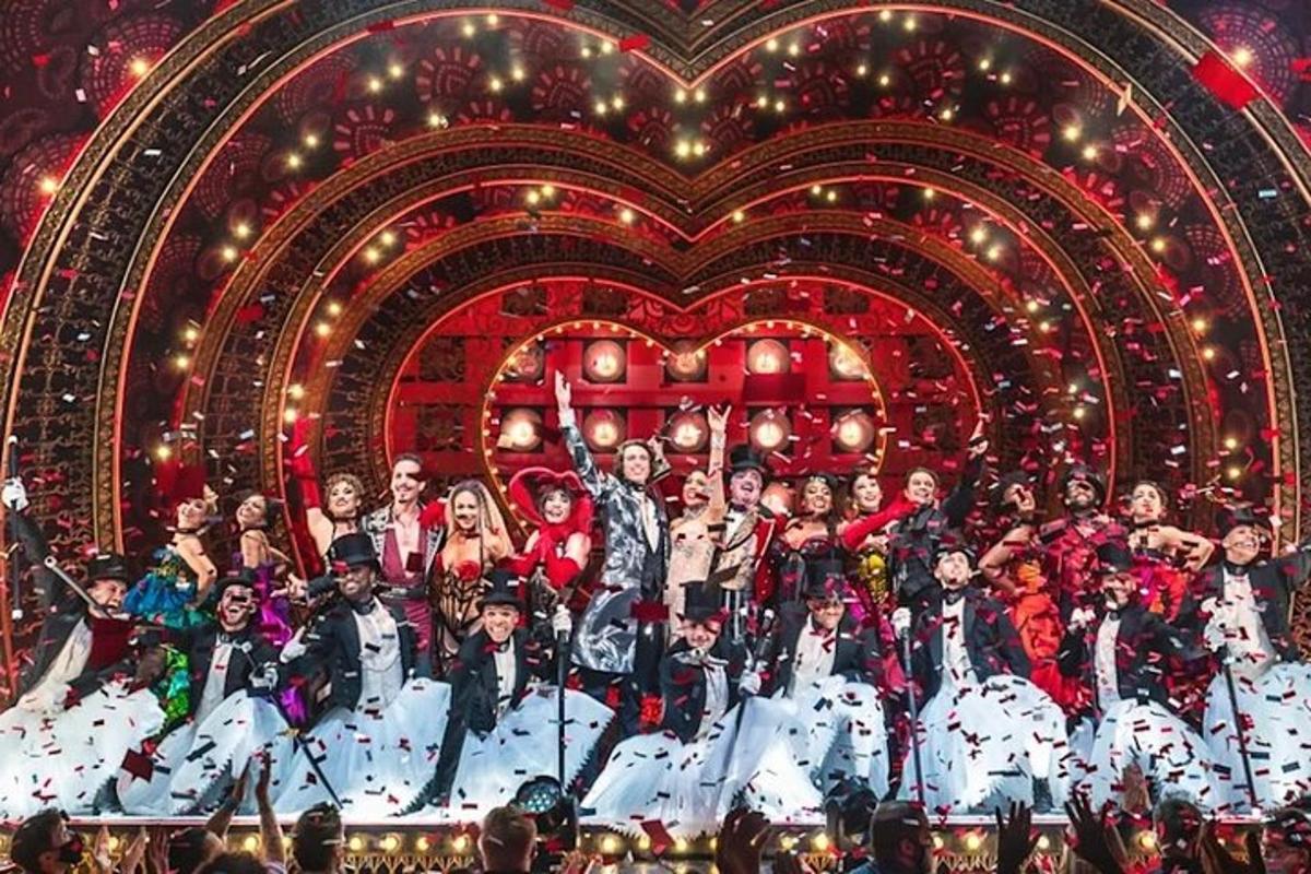 a group of people posing for a picture on a stage
