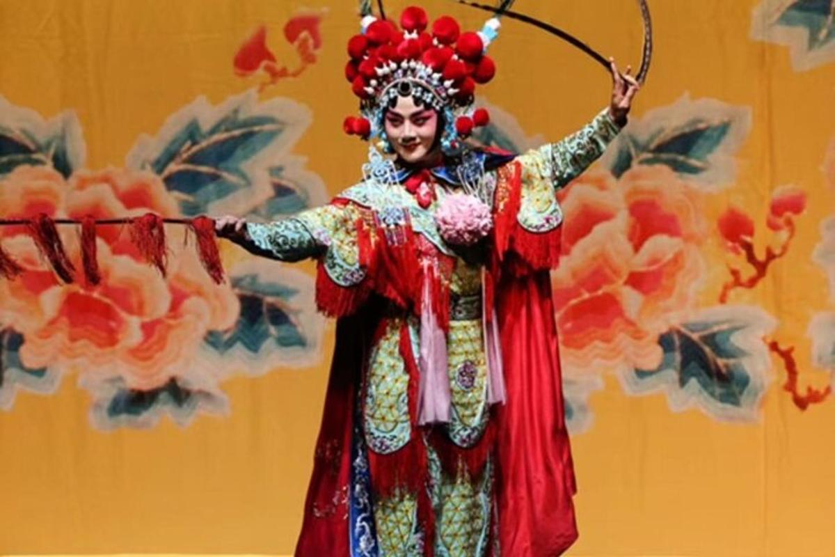 a man in a costume holding a bow and arrow