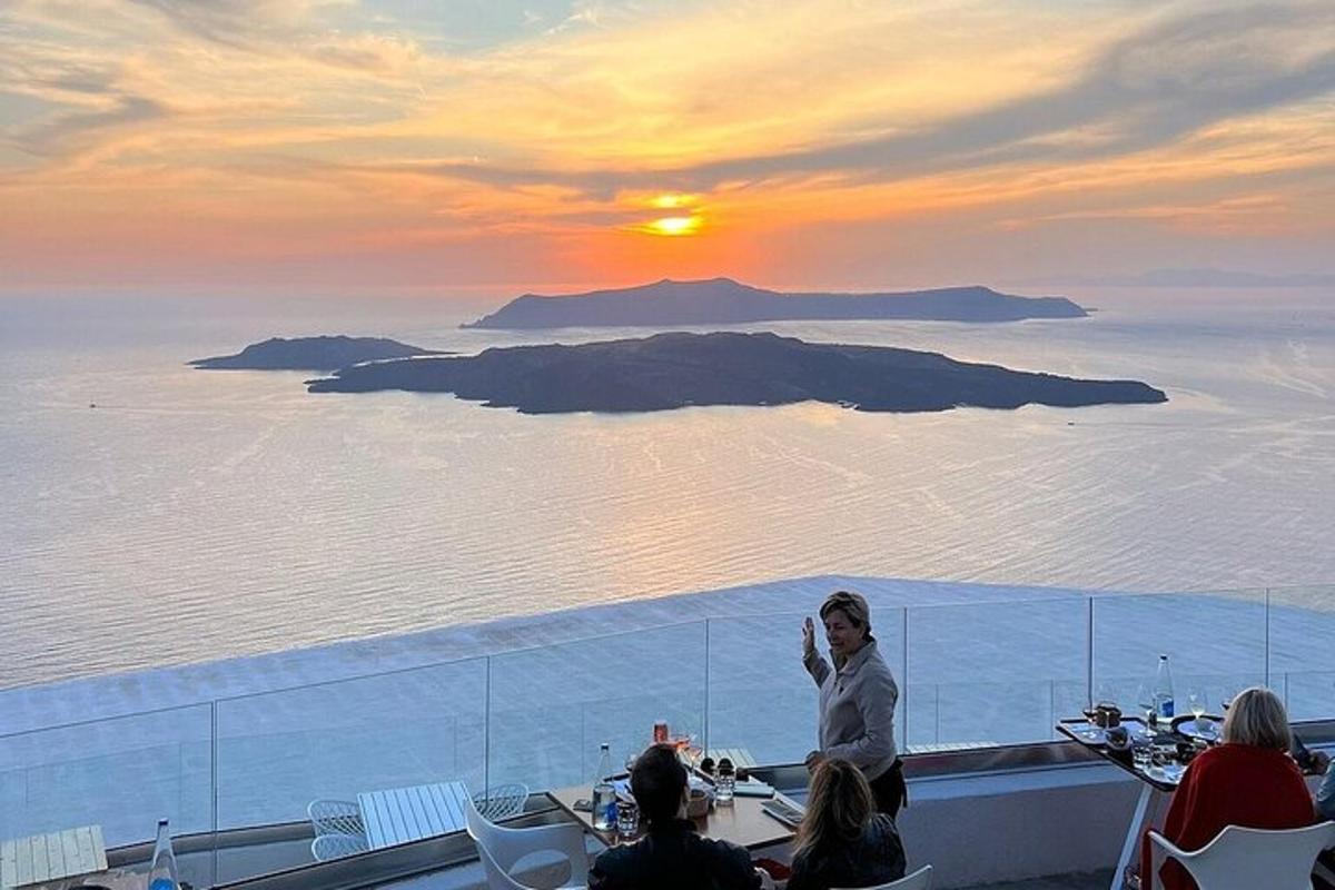 a woman standing on a balcony with a view of the ocean