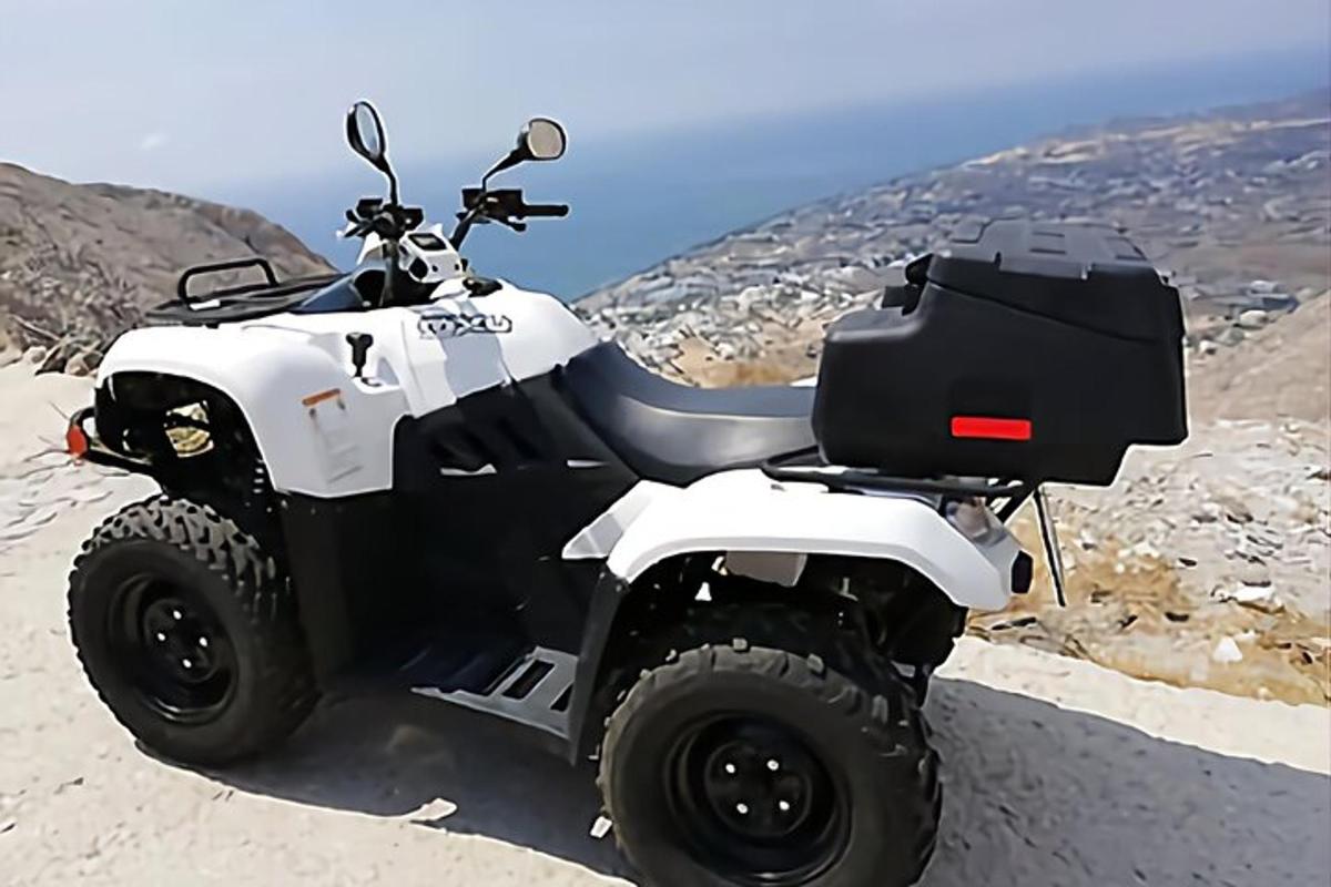 a atv parked on the side of a mountain