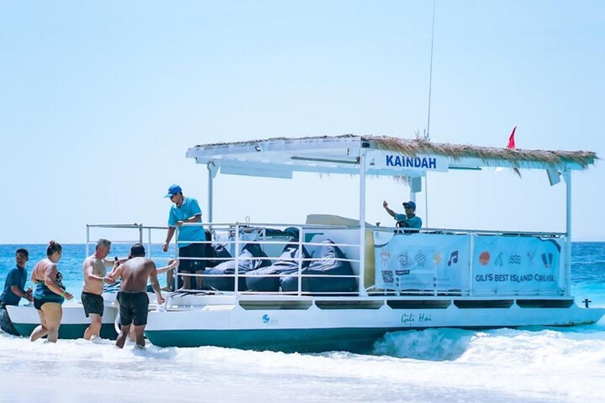 a group of people on a boat on the beach