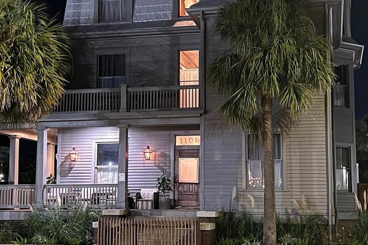 a house with a palm tree in front of it