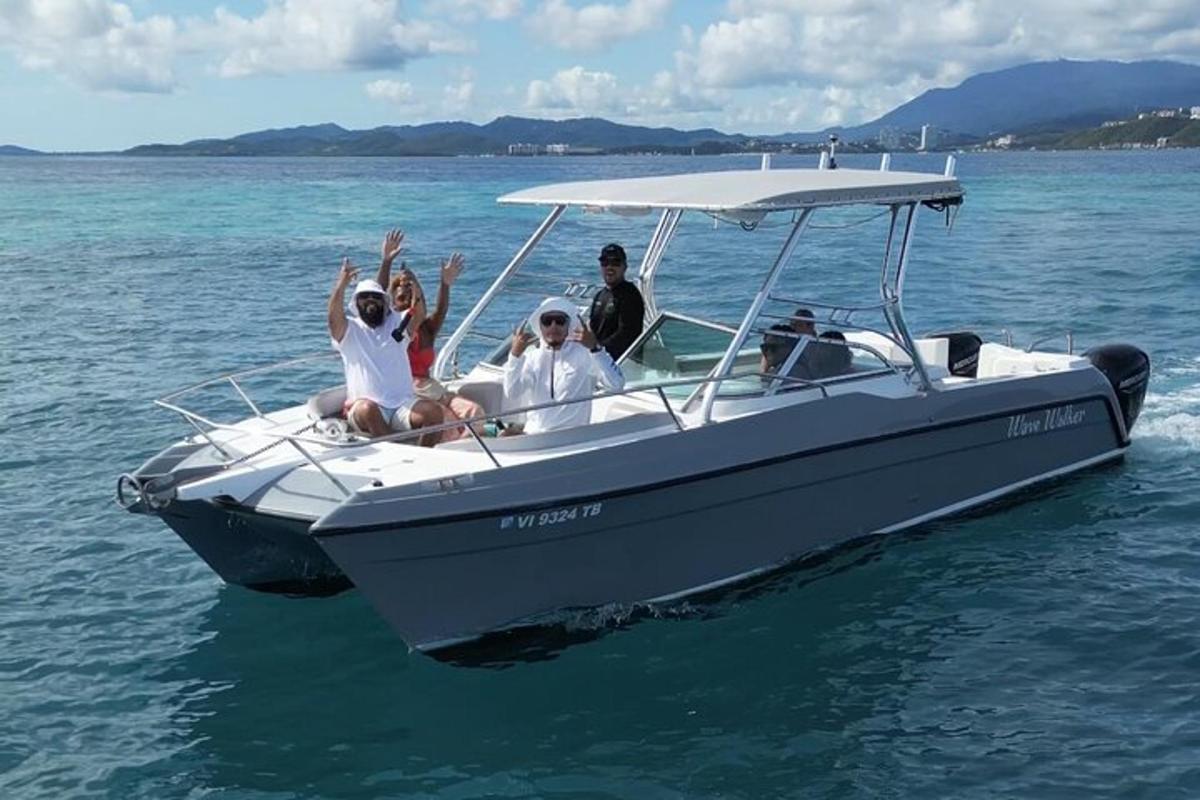 a group of people sitting on a boat in the water