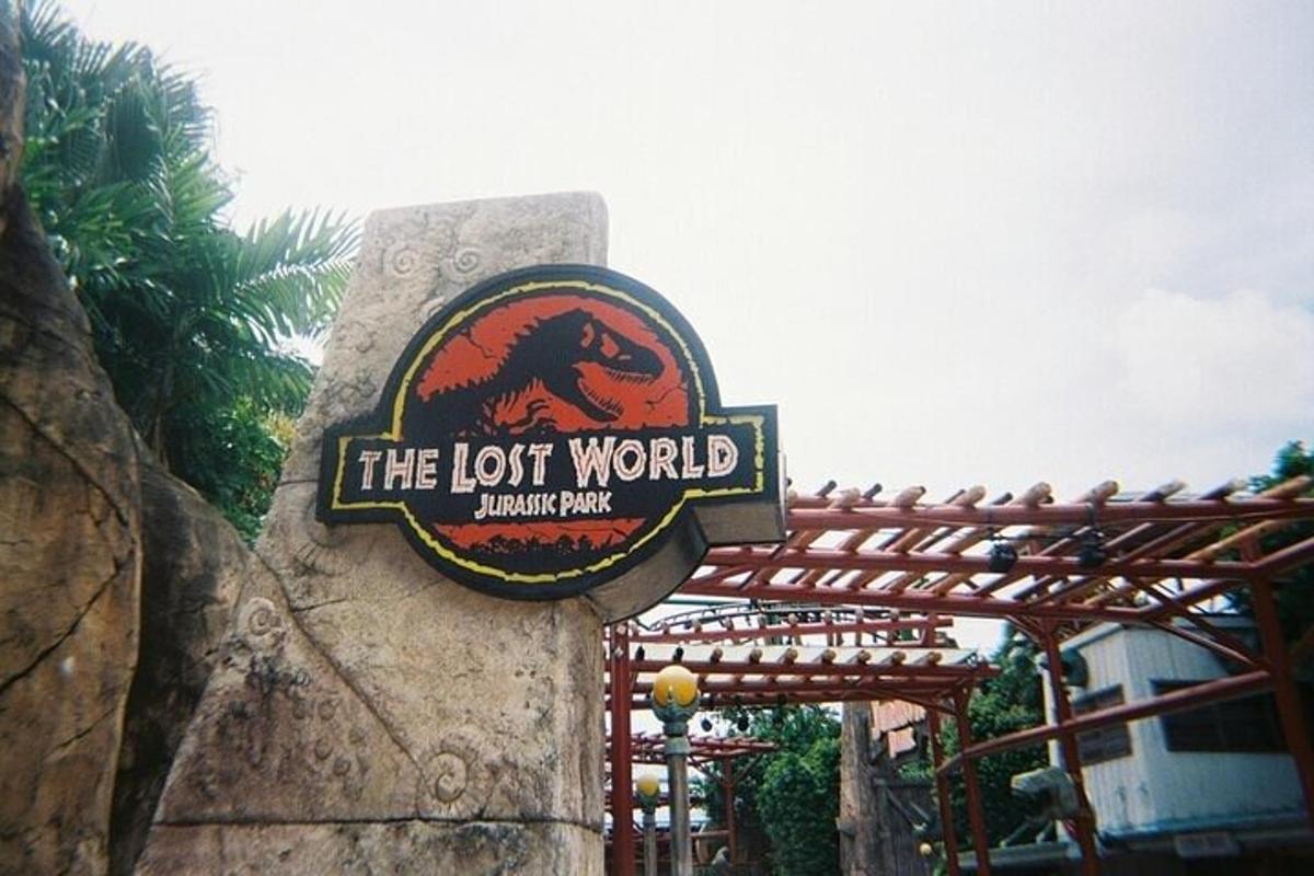 a sign for the lost world at a theme park