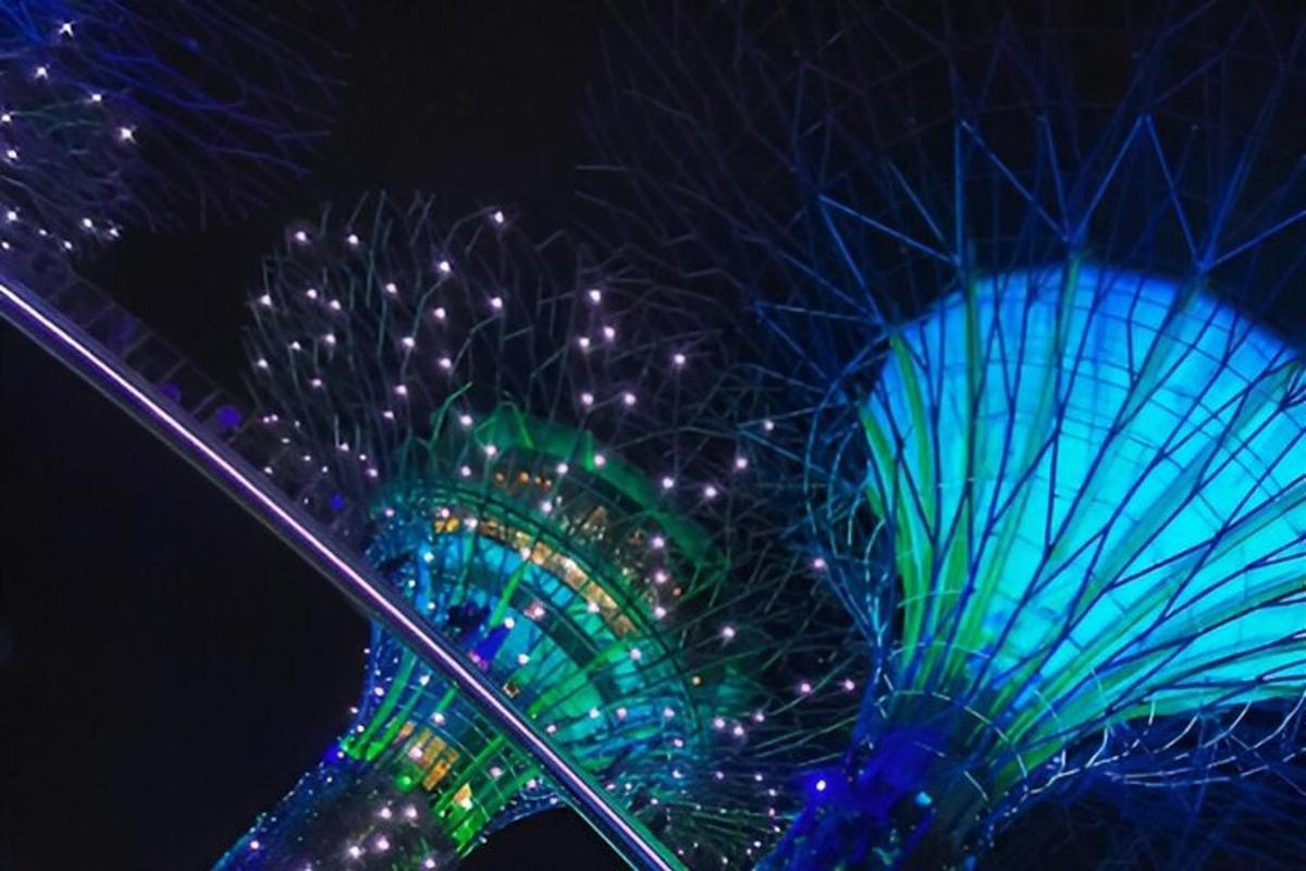 a large blue and green fan at night