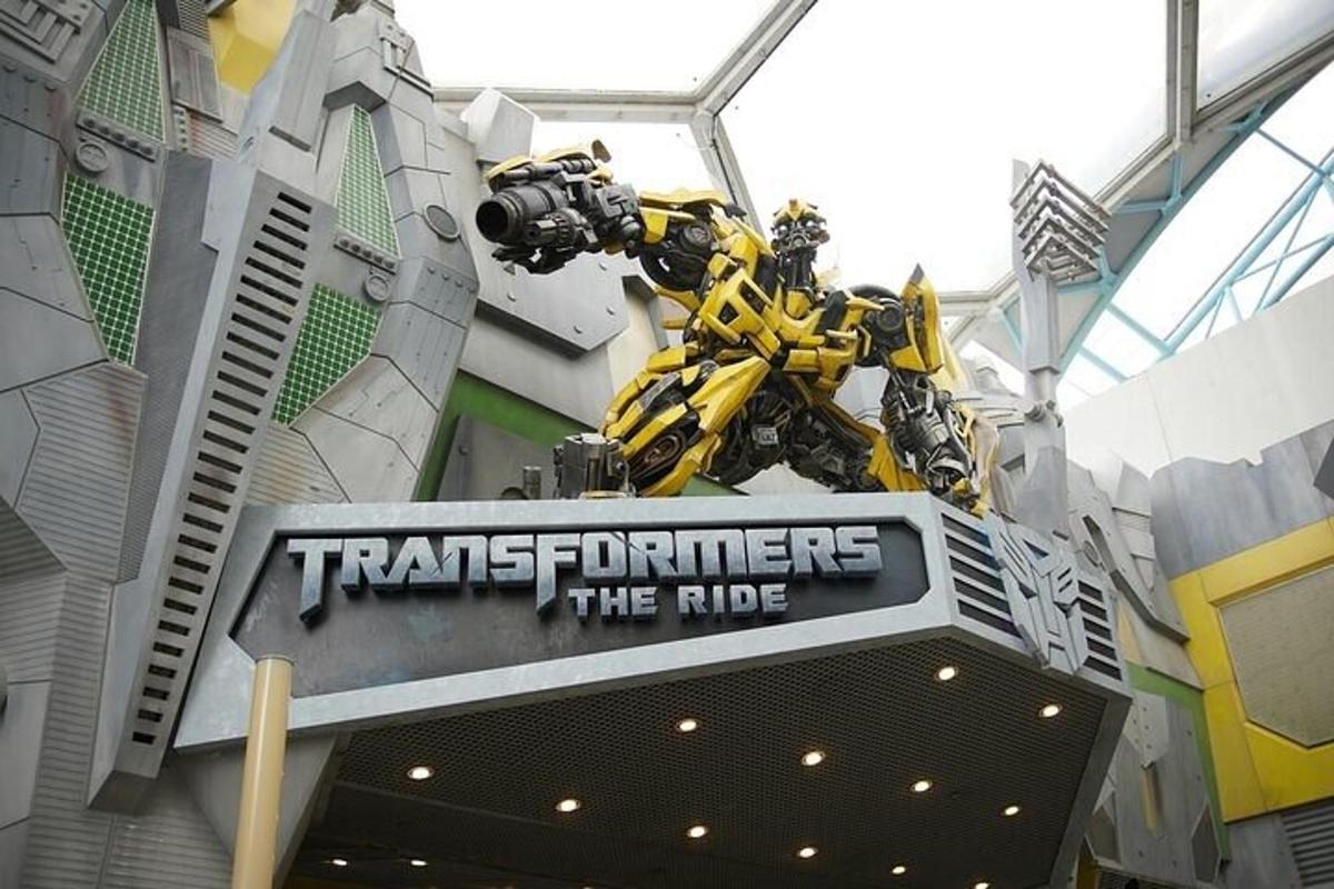 a transformers statue is on top of a sign