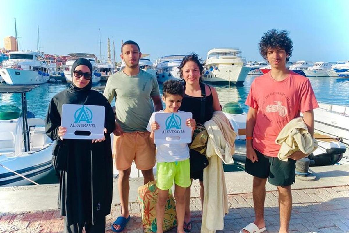 a family posing for a picture at a marina