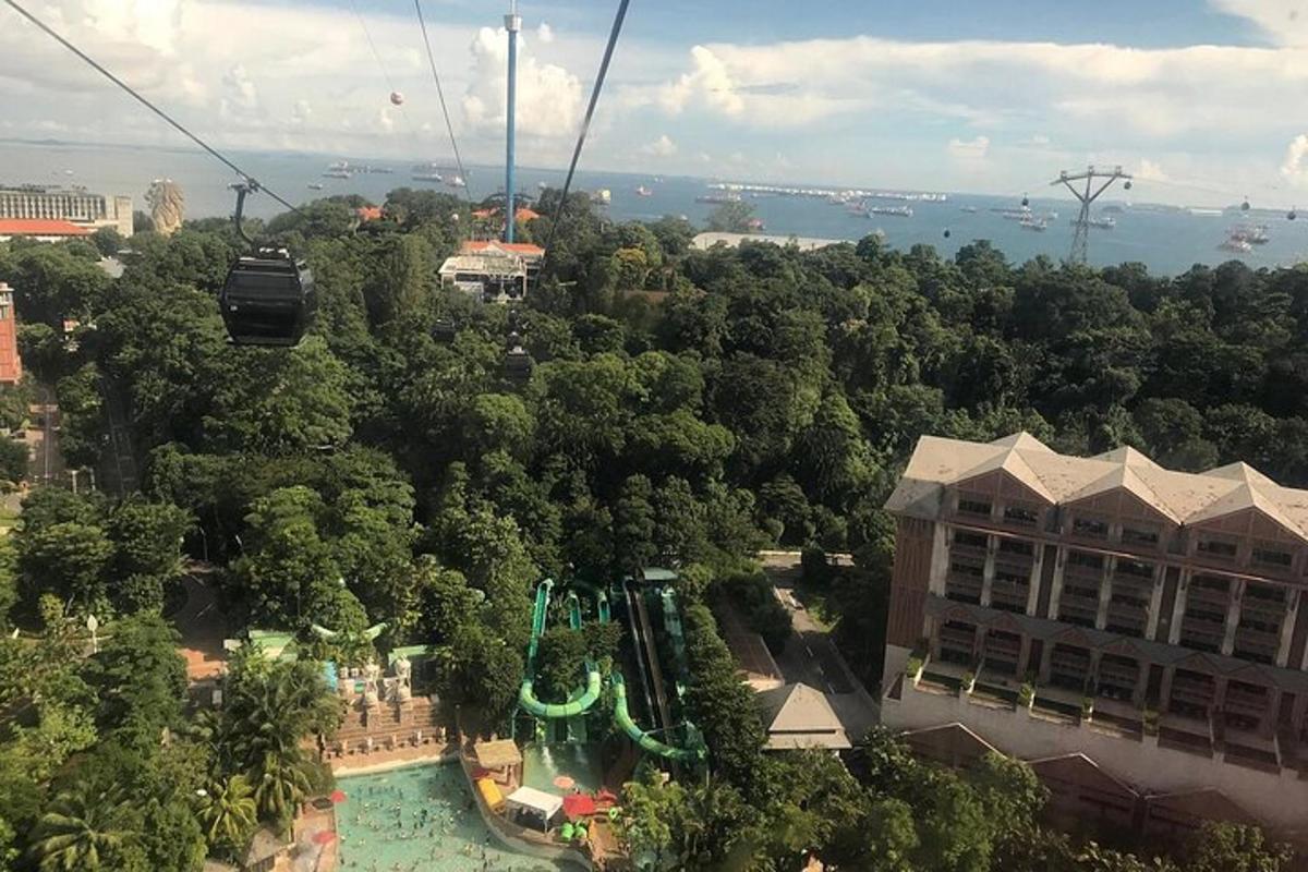 a gondola ride at a theme park with a pool