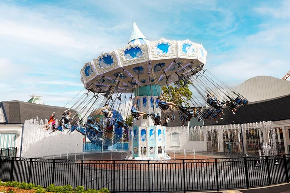 a merry go round ride in front of a building