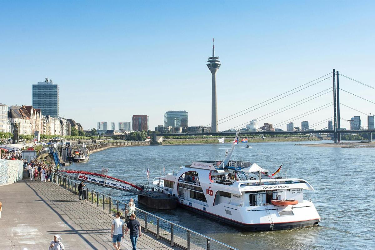 a boat is docked at a dock in a river