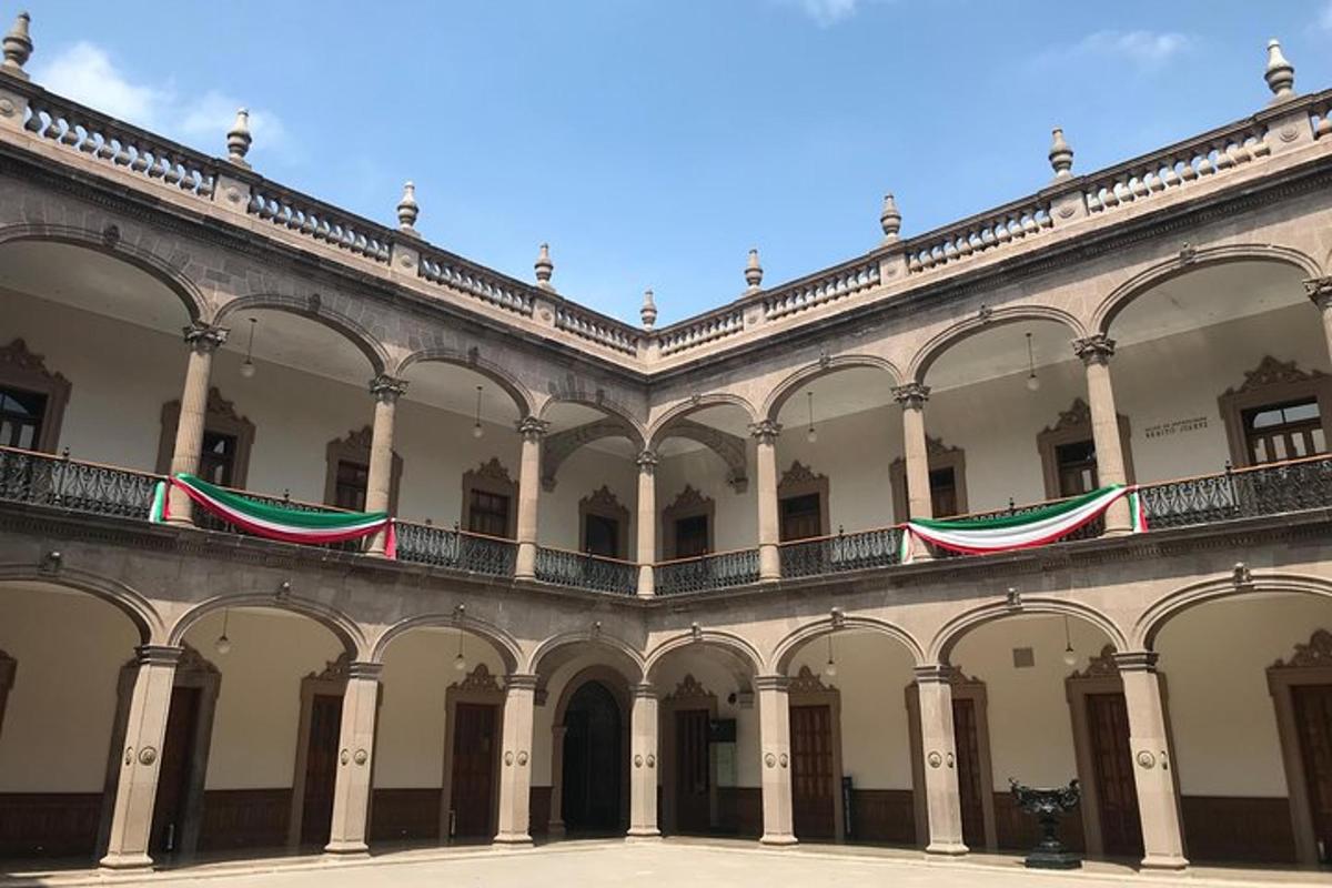 a large building with arches and balconies on it