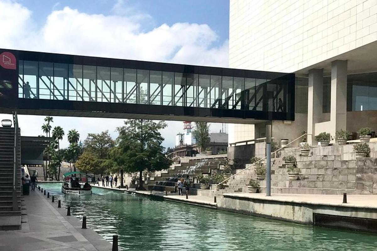 a bridge over a river in front of a building