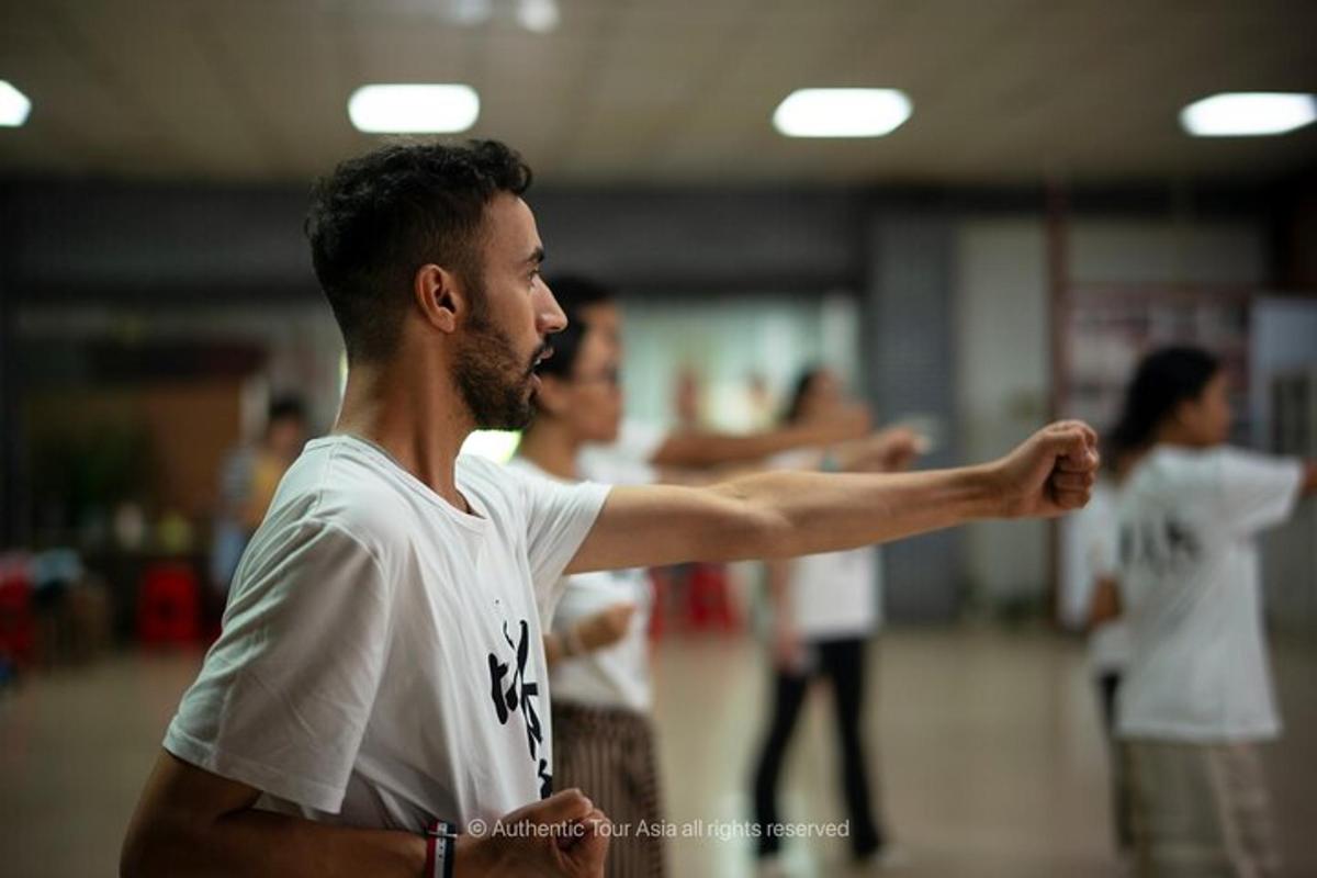 a man standing with his arm outstretched