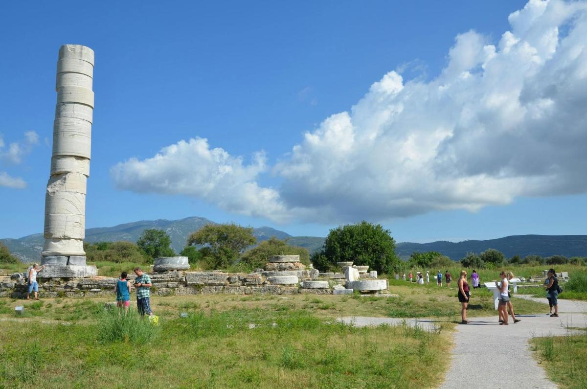a group of people walking around the ruins