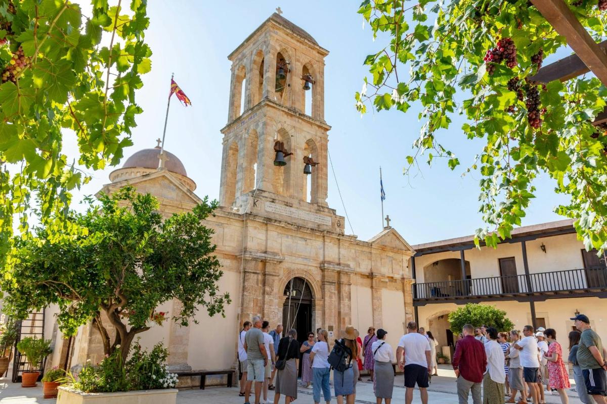 a group of people standing in front of a church
