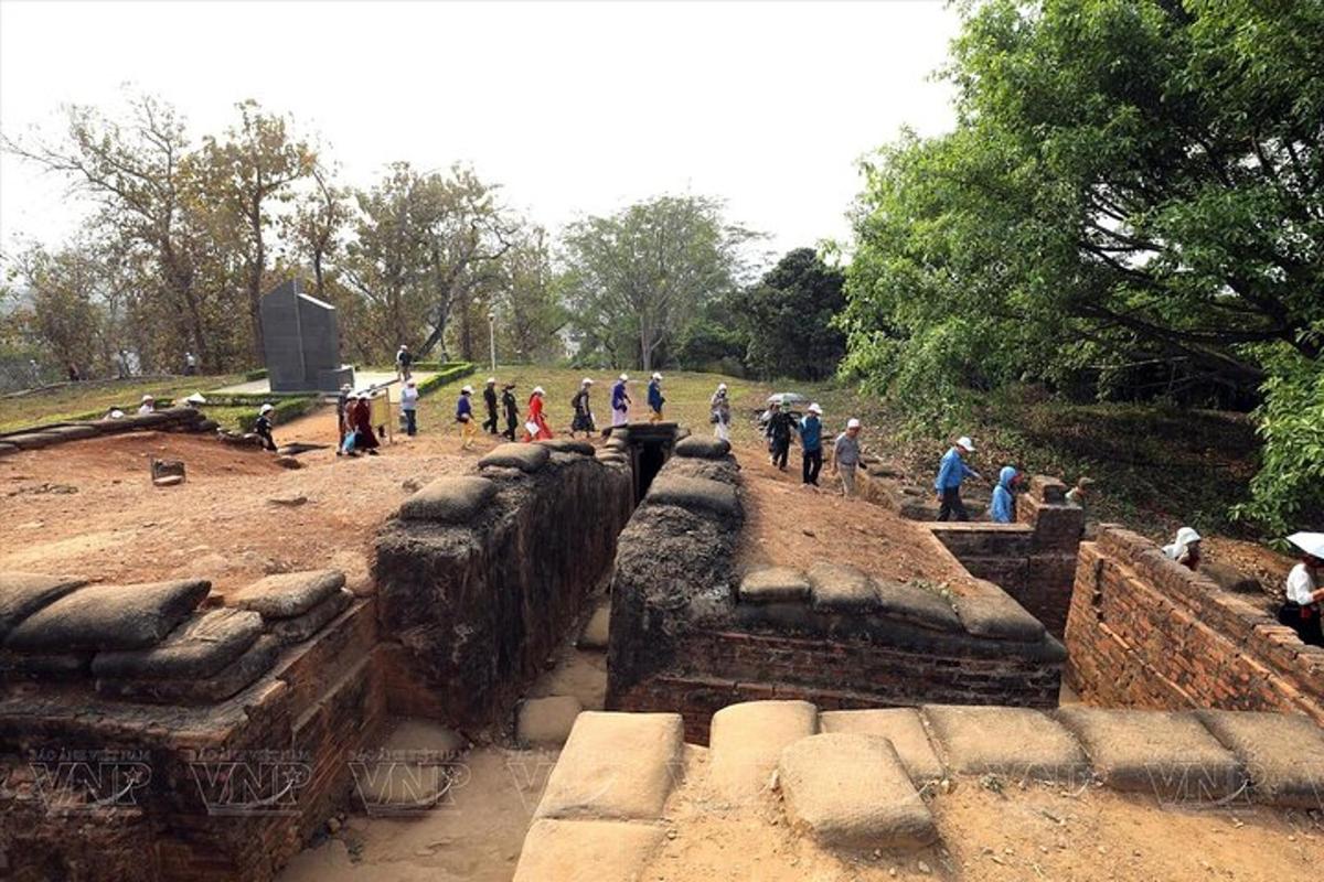 a group of people walking around a temple