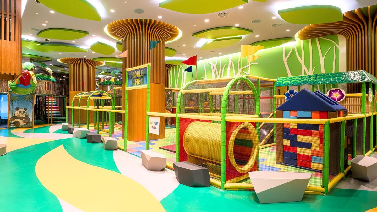 a childrens play area with many different types of play equipment