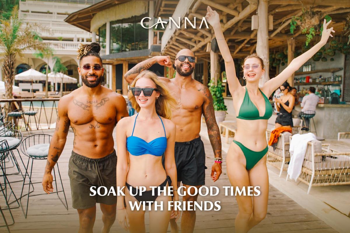 a group of people in swimsuits standing by a pool