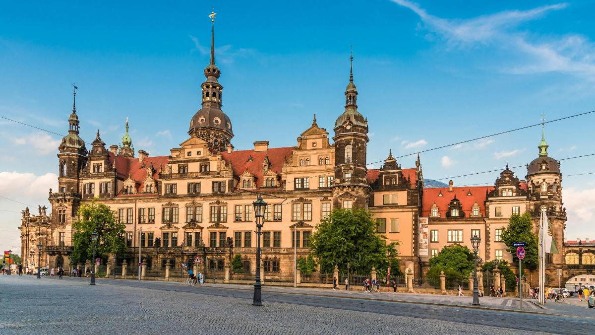 a large building with a street in front of it