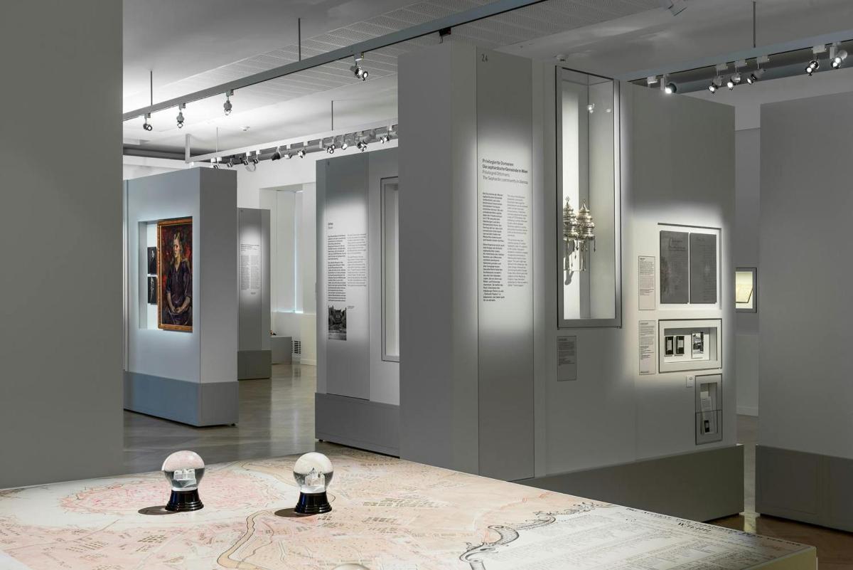 a museum exhibit with a map on the floor